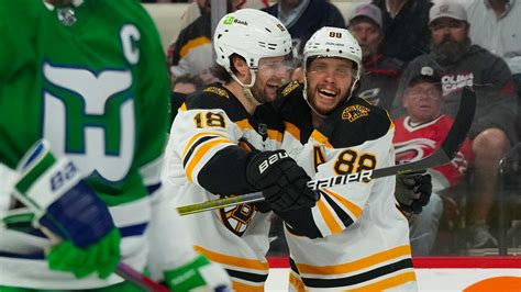 Pastrnak scores twice, Bruins top Hurricanes 4-3 in shootout